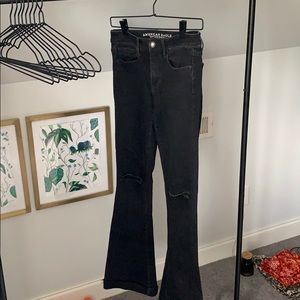 Black flare ripped knee jeans